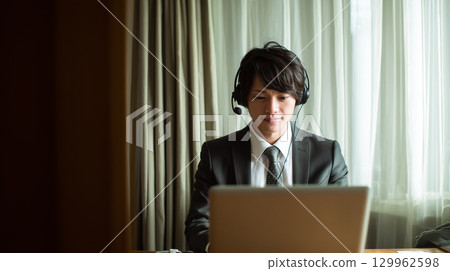 Japanese people participating in a meeting while working remotely 129962598