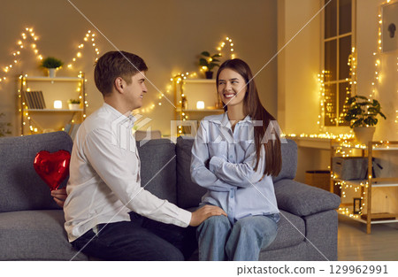 Husband Surprises Wife With Red Heart Gift For Valentine Day Celebration At Home Husband Surprises Wife With Red Heart Gift For Valentine Day Celebration At Home 129962991