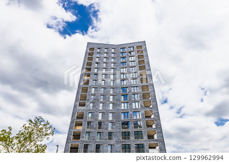 Low angle view of modern high rise apartment tower Low angle view of modern high rise apartment tower 129962994