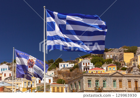 Greek Flag Flying Over Symi, Greece 129963930