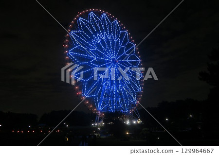 燈光璀璨的摩天輪和向日葵 燈光璀璨的摩天輪和向日葵 129964667