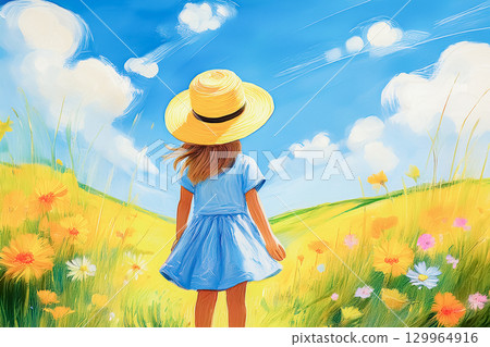 一位身穿藍色洋裝的女孩站在夏日花田裡 129964916