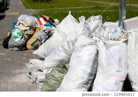 Numerous Piles of Waste Bags Have Been Collected for Proper Disposal 129965011