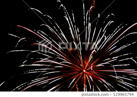 Fireworks spreading radially 129965794
