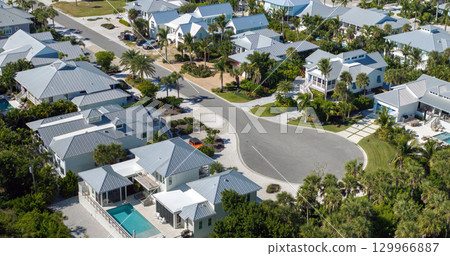 Low-density private homes. Rural street cul-de-sac dead end in residential suburbs with upscale suburban houses outside of Sarasota, Florida Low-density private homes. Rural street cul-de-sac dead end in residential suburbs with upscale suburban houses outside of Sarasota, Florida 129966887