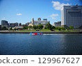 An amphibious bus passing in front of the Queen's Tower in Yokohama Minato Mirai 129967627