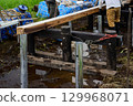 Repairing the boardwalk that protects the marshland 129968071