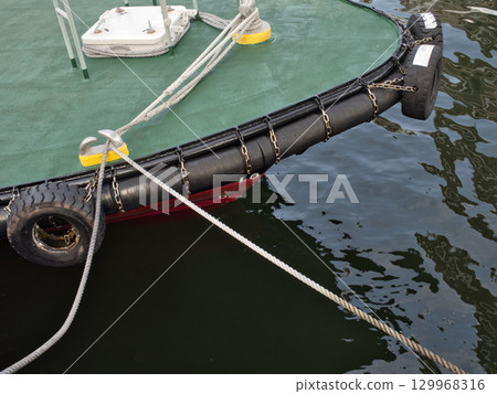 Boat moored in the harbor 129968316