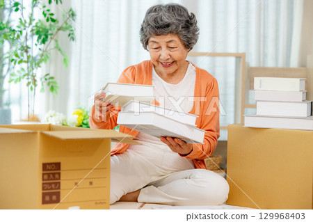 Senior cardboard end-of-life planning 129968403
