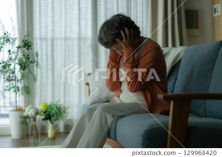 depressed elderly woman 129968420