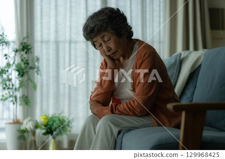 depressed elderly woman 129968425