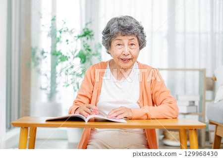 A woman writing a death notebook 129968430