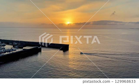 Enjoy a picturesque sunset over the harbor, combined with a delightful boat journey 129968633