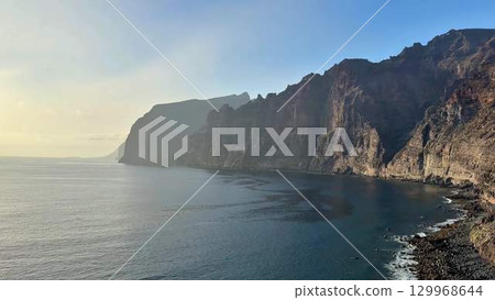 Experience the breathtaking coastal cliffs alongside serene ocean views that captivate the soul 129968644