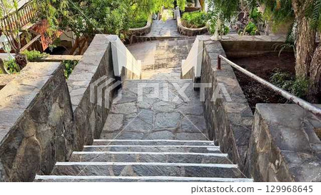 Exquisitely Beautiful Stone Steps Leading Enthusiastically to a Lush Garden Pathway Exquisitely Beautiful Stone Steps Leading Enthusiastically to a Lush Garden Pathway 129968645