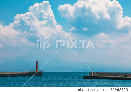 A harbor covered in summer clouds A harbor covered in summer clouds 129968733