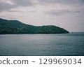 Calm sea under cloudy sky 129969034