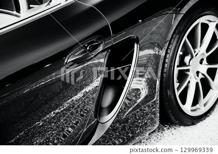 Shiny black sports car side intake 129969339