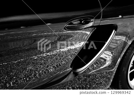 Shiny black sports car side intake 129969342