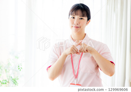 A caregiver giving a cross mark 129969606