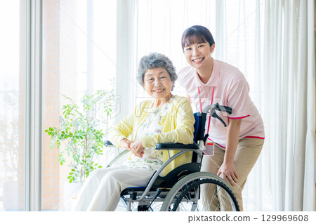 Young helper working at a nursing home 129969608