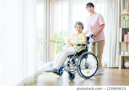 Young helper working at a nursing home 129969610