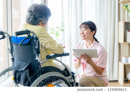 Young helper working at a nursing home 129969621