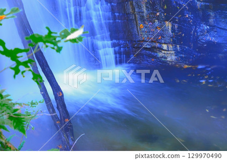 Relax in the steam of the Onikobe Onsen hot springs at the geyser Yutaki waterfall 129970490