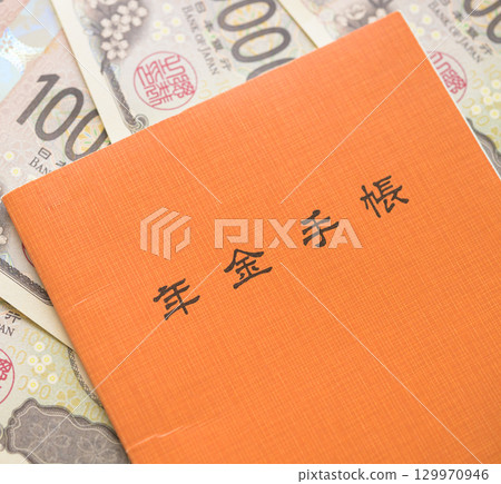 Pension book and banknotes Pension book and banknotes 129970946