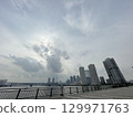 Odaiba harbor scenery under a cloudy sky 129971763