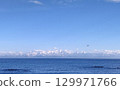 The Tateyama mountain range seen from Noto and flying birds 129971766