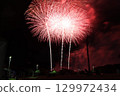 Fireworks blooming in the night sky 129972434