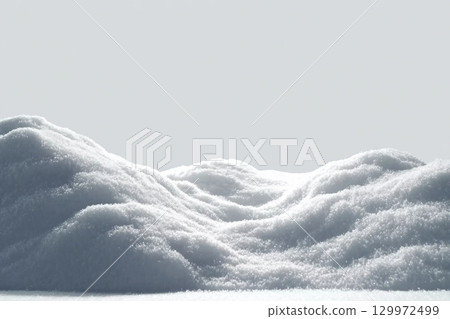 Beautiful snowdrift isolated on white background. Winter snow background. A big snow drift 129972499