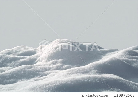 Beautiful snowdrift isolated on white background. Winter snow background. A big snow drift 129972503