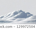 Beautiful snowdrift isolated on white background. Winter snow background. A big snow drift 129972504