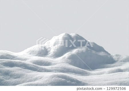 Beautiful snowdrift isolated on white background. Winter snow background. A big snow drift Beautiful snowdrift isolated on white background. Winter snow background. A big snow drift 129972506