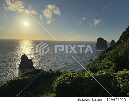 Sunset over the sea 129974013