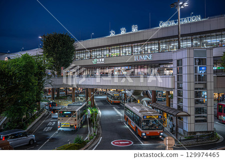 Night view of the west exit of JR Omiya Station. The bustling bus terminal. 129974465