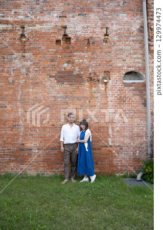 A middle-aged couple traveling through the Handa Red Brick Building (former site of Kabuto Beer) in the Handa area of Aichi Prefecture A middle-aged couple traveling through the Handa Red Brick Building (former site of Kabuto Beer) in the Handa area of Aichi Prefecture 129974473
