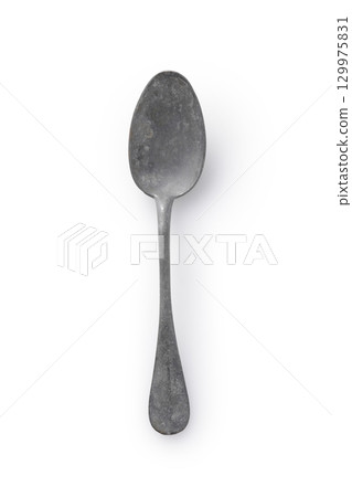 Antique spoon on a white background 129975831