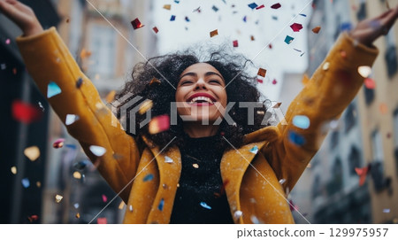 Vibrant New Year Celebration on City Streets with Crowds Cheering and Fireworks 129975957