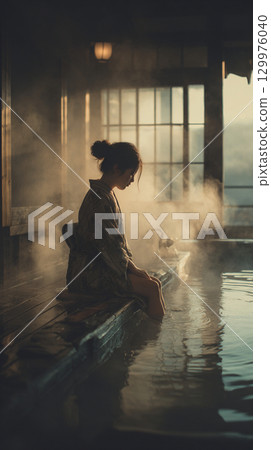 A woman entering a hot spring A woman entering a hot spring 129976040