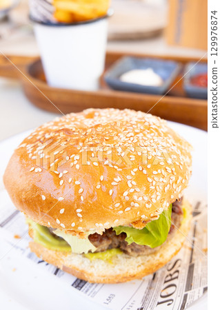 Delicious hamburgers Delicious hamburgers 129976874