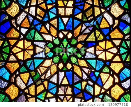 Colorful stained glass with transparent geometric patterns Colorful stained glass with transparent geometric patterns 129977318