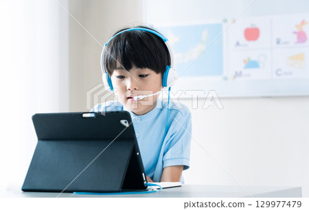 Boy taking online classes 129977479