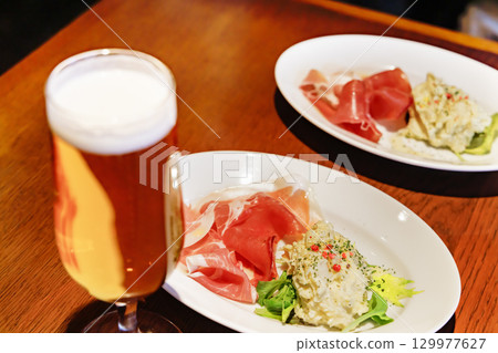 Cold beer and delicious food 129977627