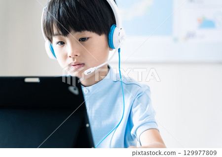 Boy taking online classes Boy taking online classes 129977809