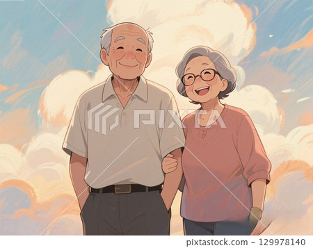 A friendly elderly couple smiling and holding hands 129978140