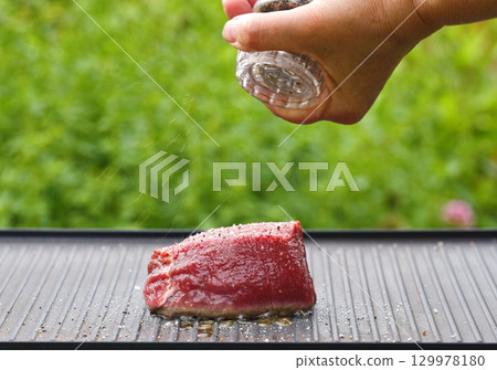 cook preparing fresh raw beef fillet mignon steak cook preparing fresh raw beef fillet mignon steak 129978180