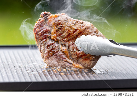 freshly grilled beef ribeye steak 129978181